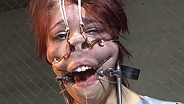 Close-up of Nose-Hooked BDSM Girl Wearing Spider Gag, Drooling and Submissive in Intense Bondage Scene